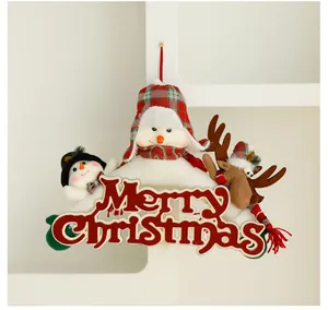 Close-up of Christmas door hanging with plush snowmen, reindeer, and Merry Christmas sign