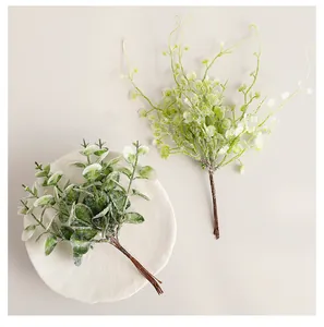 High-detail top view of frosted artificial eucalyptus and bushy greenery sprigs