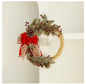 Macro view of Christmas wreath featuring red bow, pinecone, and berries