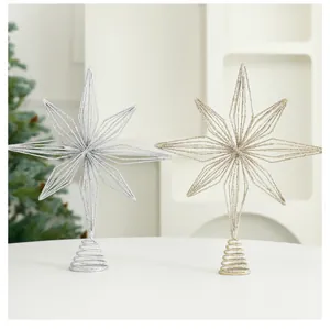 Detailed view of glittery gold and silver eight-pointed star Christmas tree toppers.
