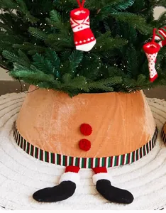 Detail of brown velvet Christmas tree collar with elf boots and striped trim