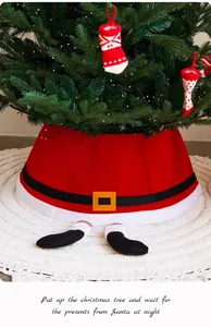 Close-up of a festive Santa suit Christmas tree skirt with decorative hanging socks.