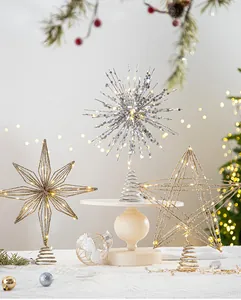 Lighted silver snowflake and golden star Christmas tree toppers with LED lights