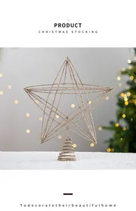 Champagne gold glitter star Christmas tree topper with warm festive bokeh background
