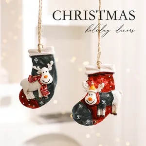 Decorative hand-painted resin reindeer and stocking ornaments for Christmas trees