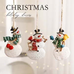 Set of three festive resin snowman Christmas tree hanging ornaments with rustic twine
