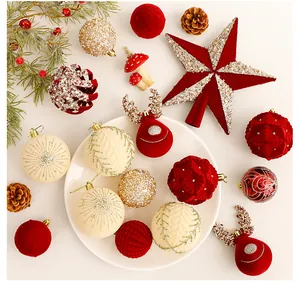 Beautiful assortment of Christmas ornaments with red flocked balls and golden star.