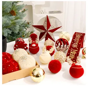 Macro view of festive Christmas ornaments set with flocking balls and a red star topper