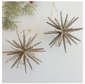 Close-up detail of champagne gold glitter starburst ornaments for Christmas tree decor