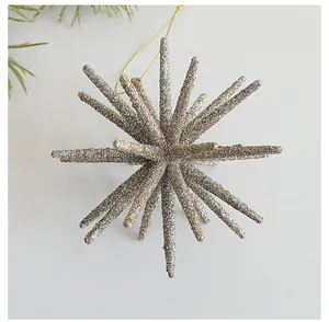 Close-up of champagne glitter starburst ornament for Christmas tree decoration