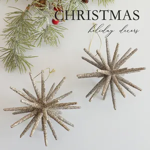 Champagne glitter explosion star Christmas tree ornaments with festive pine needle decor