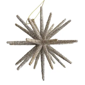 Sparkling champagne gold starburst Christmas ornament for festive holiday tree decoration