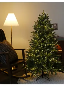 Warm white LED firecracker string lights glowing on a decorated indoor Christmas tree.
