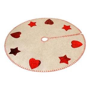 Large beige felt Christmas tree skirt with red sequin stars and hearts decoration