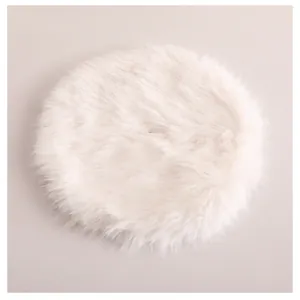Top-down view of a plush white faux fur circular Christmas tree skirt decoration