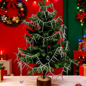Close-up detail of clear acrylic icicle ornaments hanging on a festive Christmas tree
