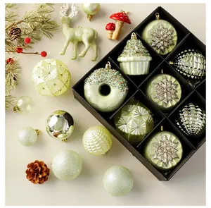 Detail view of mint green Christmas ornaments set in a box with festive holiday decor.