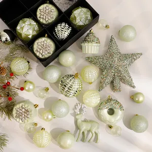 Elegant light green and gold Christmas ornament set including glitter stars, deer, and balls