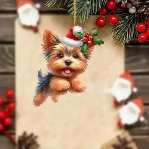 Lindo adorno navideño de acrílico Yorkshire Terrier colgado en una rama festiva.