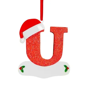 Red glitter alphabet letter U Christmas ornament with a Santa hat hanging decoration