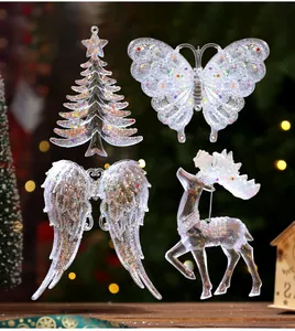 Set of sparkling transparent acrylic Christmas ornaments with iridescent glitter and stars