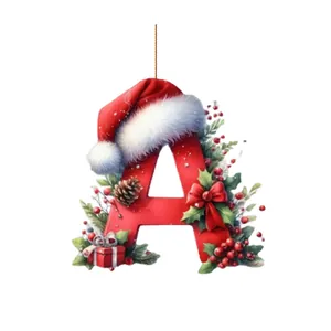 Adorno navideño de acrílico letra A roja con un gorro de Papá Noel y bayas rojas.