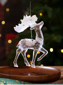 Detail of transparent acrylic reindeer Christmas ornament with sparkling glitter antlers