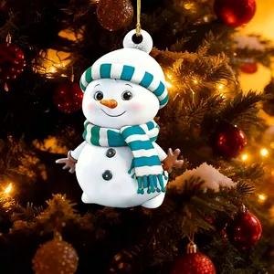 Detailed view of a cute cartoon snowman ornament hanging on a festive Christmas tree