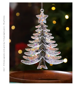 Close-up of a clear acrylic Christmas tree ornament with colorful glitter inside