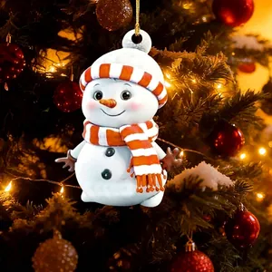 Detailed close-up of a cute cartoon snowman ornament hanging on a festive Christmas tree