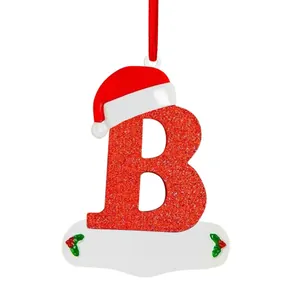 Red glittery letter B Christmas ornament with a Santa hat for tree decoration.