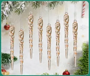Set of champagne-colored spiral acrylic icicle ornaments hanging on a Christmas tree