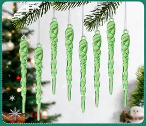 Macro view of green acrylic spiral icicle ornaments hanging on a Christmas tree