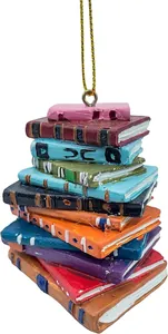 Macro view of colorful stacked books acrylic Christmas ornament with gold string