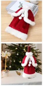 Detailed view of red velvet Christmas wine bottle cover with white fur trim