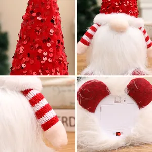 Festive Christmas gnome decoration with red sequin hat and battery-powered light base