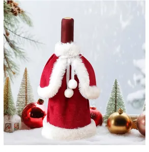 Macro detail of red velvet Christmas wine bottle cover featuring plush white faux fur trim