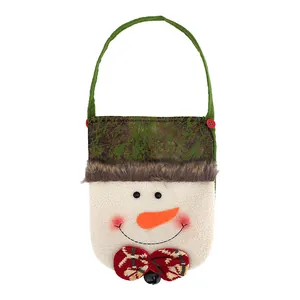 Adorable snowman themed Christmas treat bag with green handle and red plaid bow tie