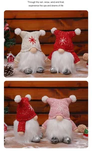 Detail shot of three colorful Christmas gnomes with sequined hats on a wooden background.