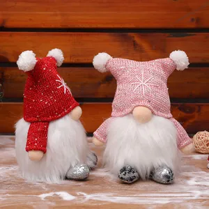 Pair of festive glowing Christmas gnomes with sequined hats and faux fur beards
