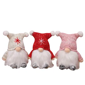 Three lighted Christmas gnomes plush dolls for festive holiday window decoration