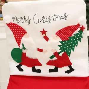 Festive white plush Christmas gnome chair cover with merry Christmas embroidery detail