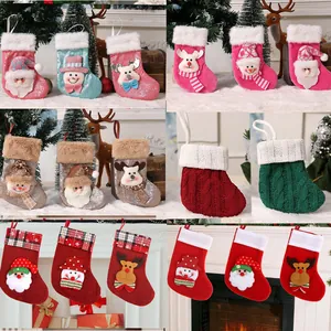 Set of mini Christmas stockings with knitted and sparkly designs featuring Santa and Snowman