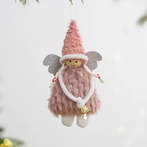 Adorable pink plush Christmas angel ornament hanging on a tree with festive bokeh lights