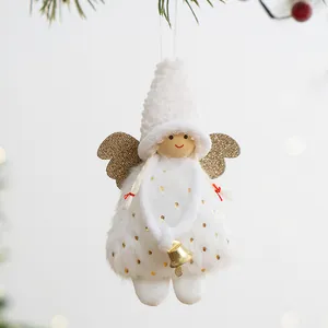 White plush Christmas angel ornament with gold glitter wings and bell hanging on tree