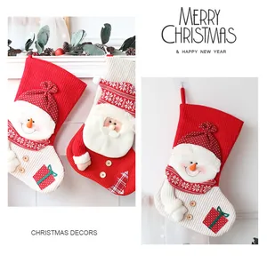 Detailed view of festive knitted Christmas stockings featuring Santa and Snowman designs