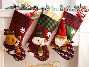 Festive Christmas stockings set featuring plush Santa Snowman and Reindeer decorations