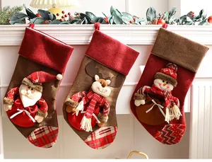 Festive 3D Christmas stockings featuring Santa, reindeer and snowman hanging on a mantel.