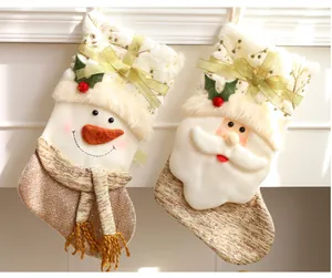 Plush Christmas stockings featuring Santa Claus and Snowman designs for holiday decor.