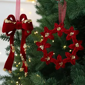 Luxury red flocked Christmas ornaments with gold sequins hanging on a festive tree